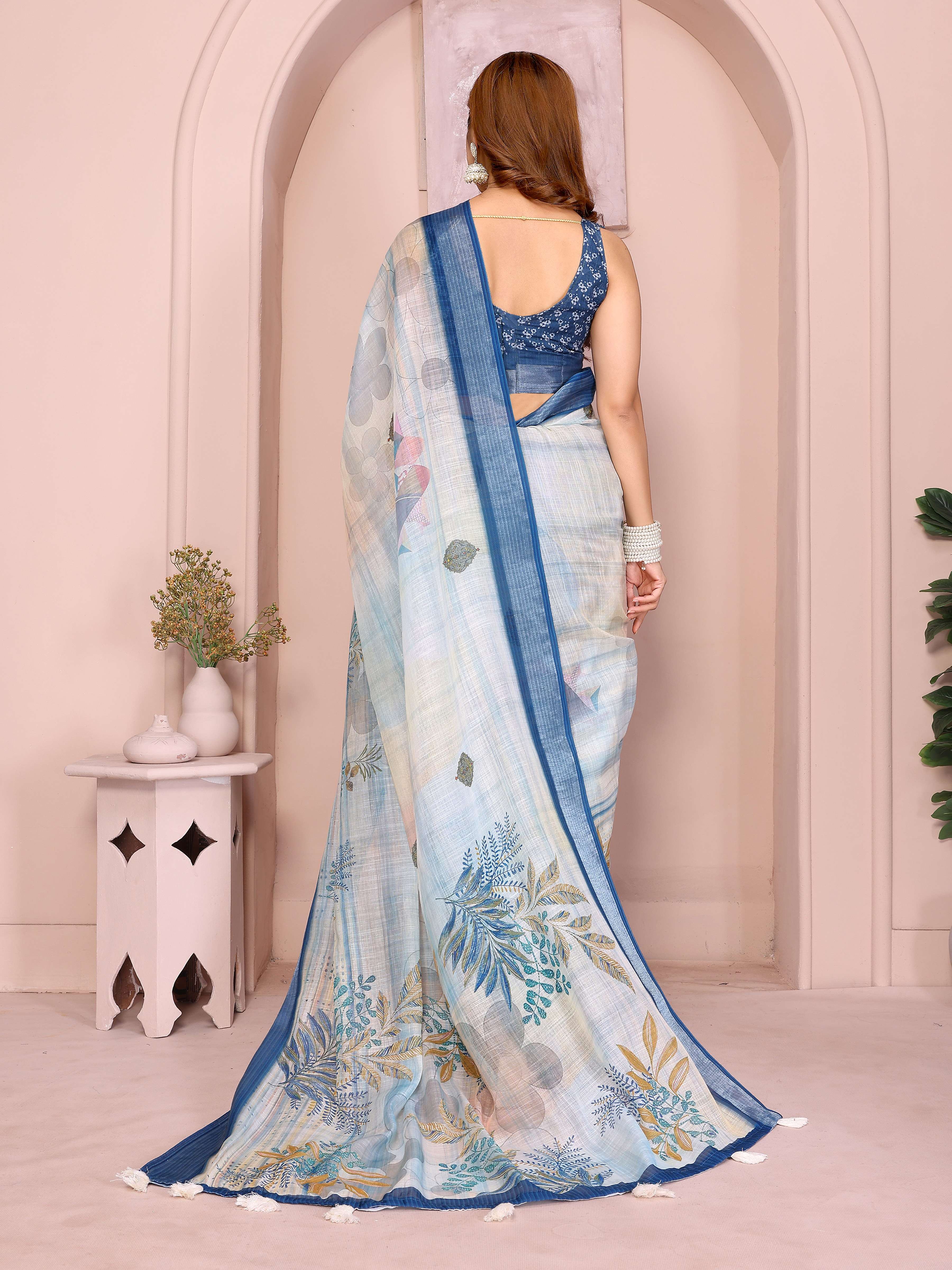Pastel Blue Linen Cotton Saree with Tropical Leaf Prints & Tassel Pallu